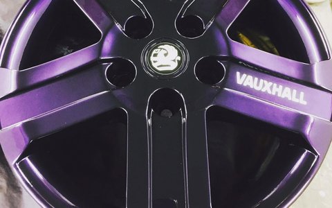 Alloy wheel refinished in gloss purple