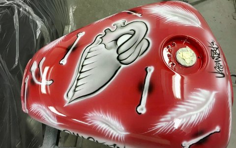 Motorcycle fuel tank with custom red airbrushed design